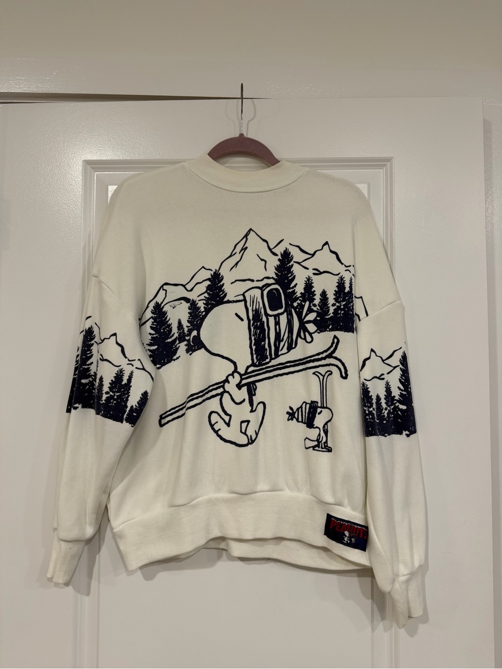 Peanuts White Crewneck Sweater with Navy Ski Graphic